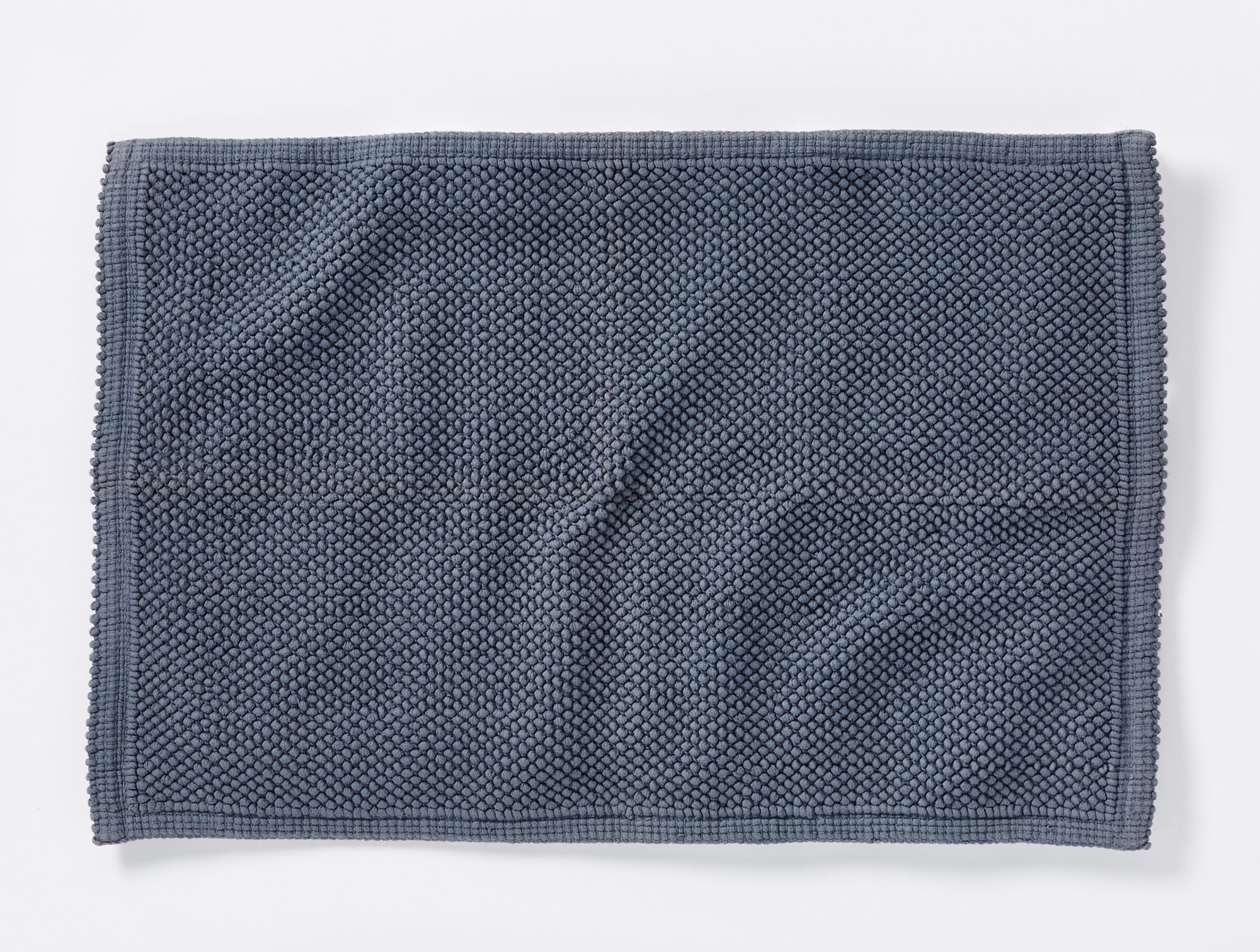 https://www.coyuchi.com/cdn/shop/files/PDP_Pebbled_BathRug_FrenchBlue_B_FALL21_15994.jpg?v=1699135632&width=2000