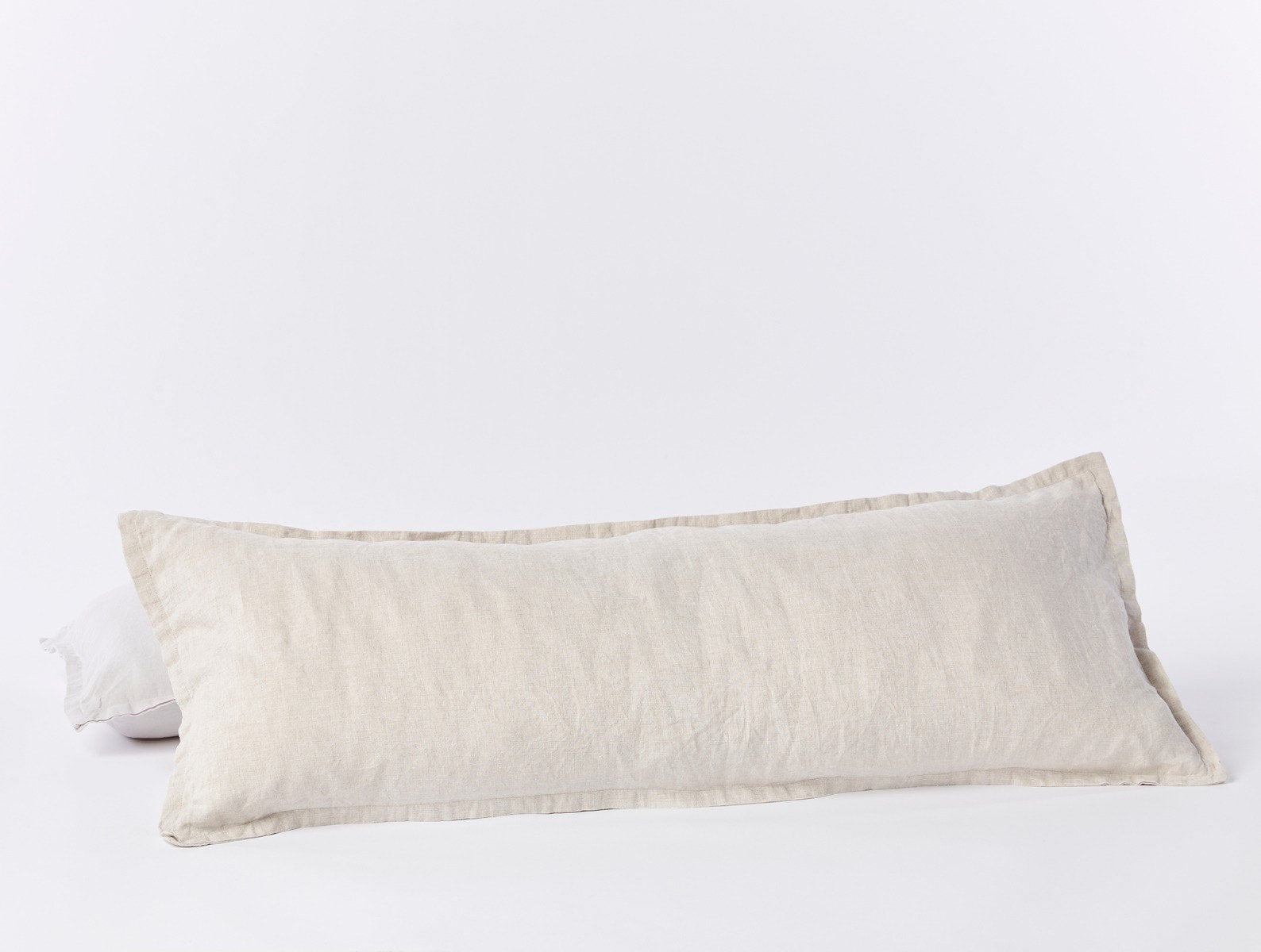 https://www.coyuchi.com/cdn/shop/files/pdp_relaxedlinen_lumbarpillow_naturalchambray_b_sp21.jpg?v=1689165938